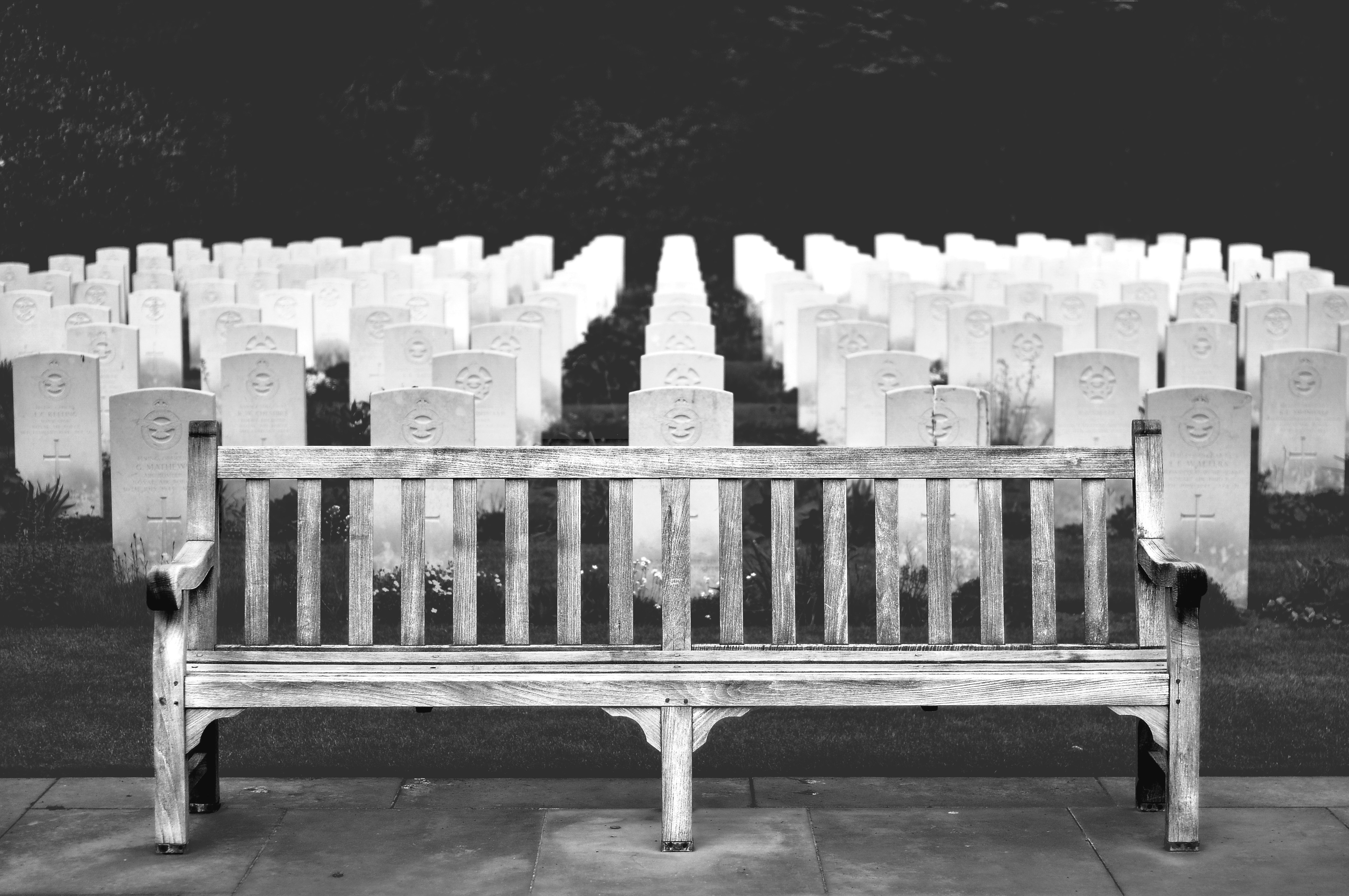 grayscale photo of wooden bench