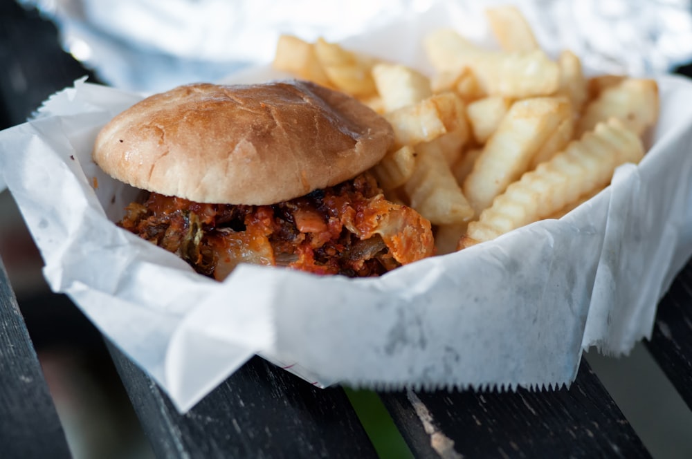 burger and fries on bowl