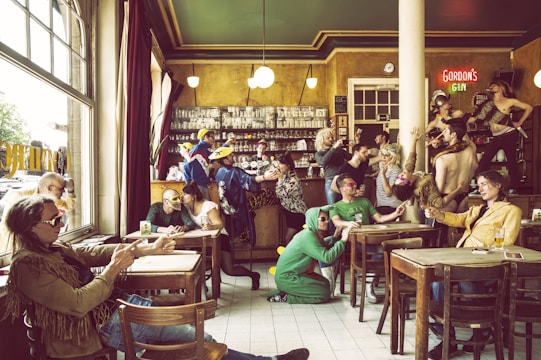A themed bar night with decorations, a DJ playing, and guests dressed accordingly.