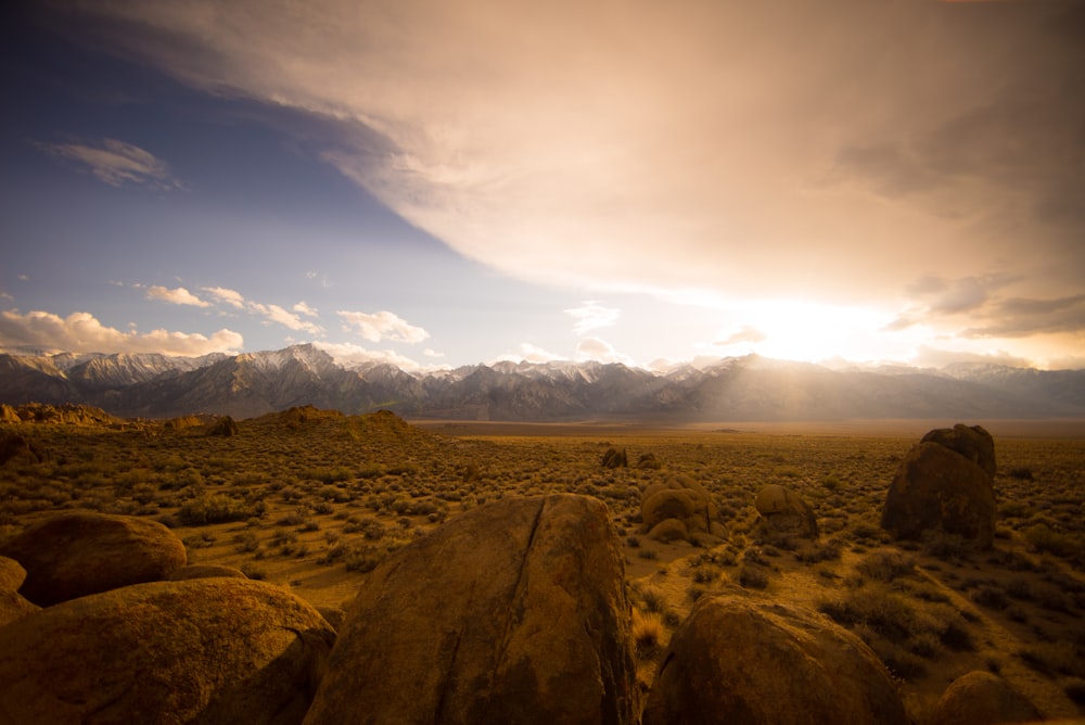 brown desert under cloudy sky