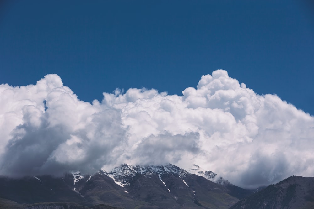 white clouds in top of mountain