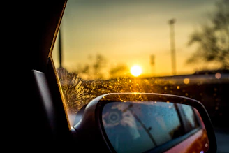 Sunset glow reflecting off a cool white interior window treated with premium solar defense film.