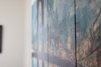 Close-up of a miniature oil painting grid with soft, blurred edges.