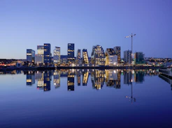 cityscape by water during golden hour