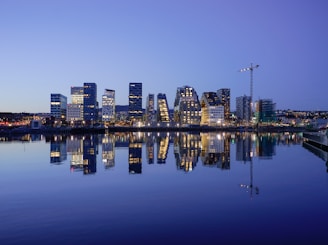 cityscape by water during golden hour
