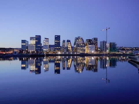 cityscape by water during golden hour