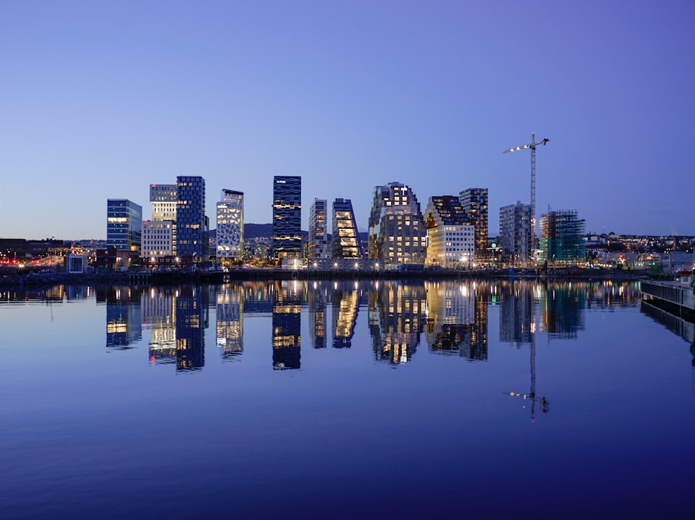 cityscape by water during golden hour