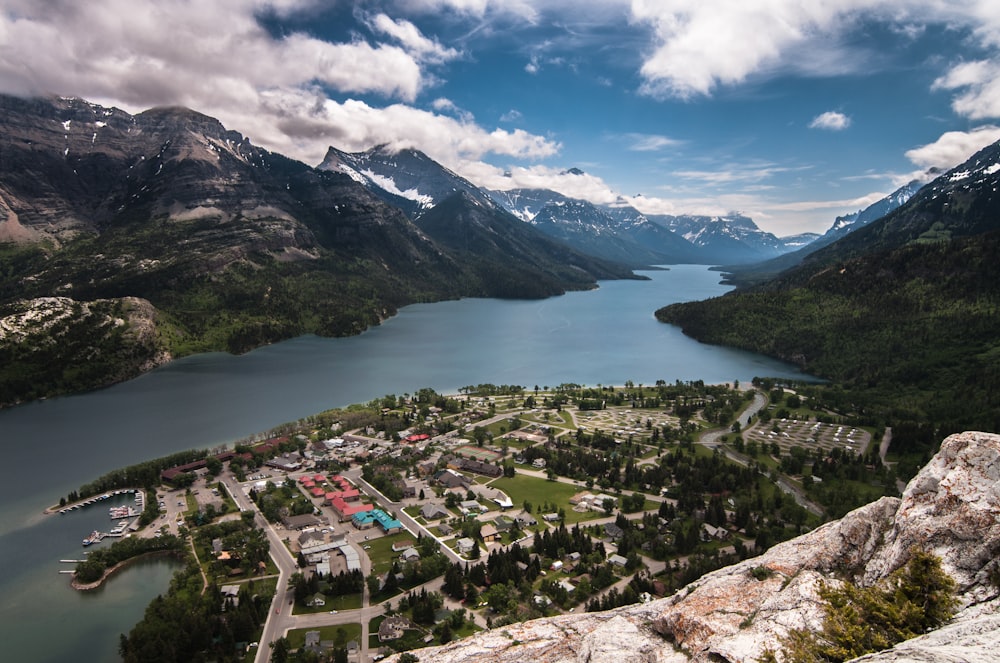 aerial photo of village near body of water