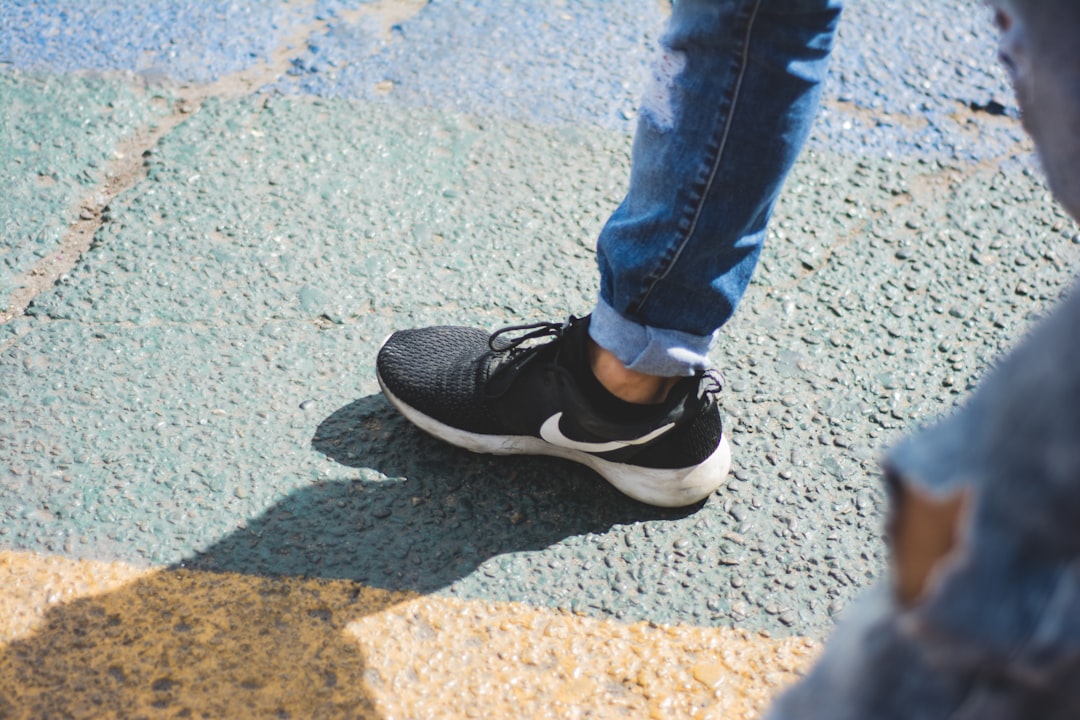 person walking on concrete floor