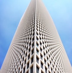architectural and low-angle photo of white high rise building