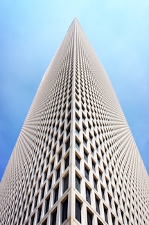 architectural and low-angle photo of white high rise building