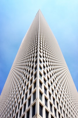 architectural and low-angle photo of white high rise building