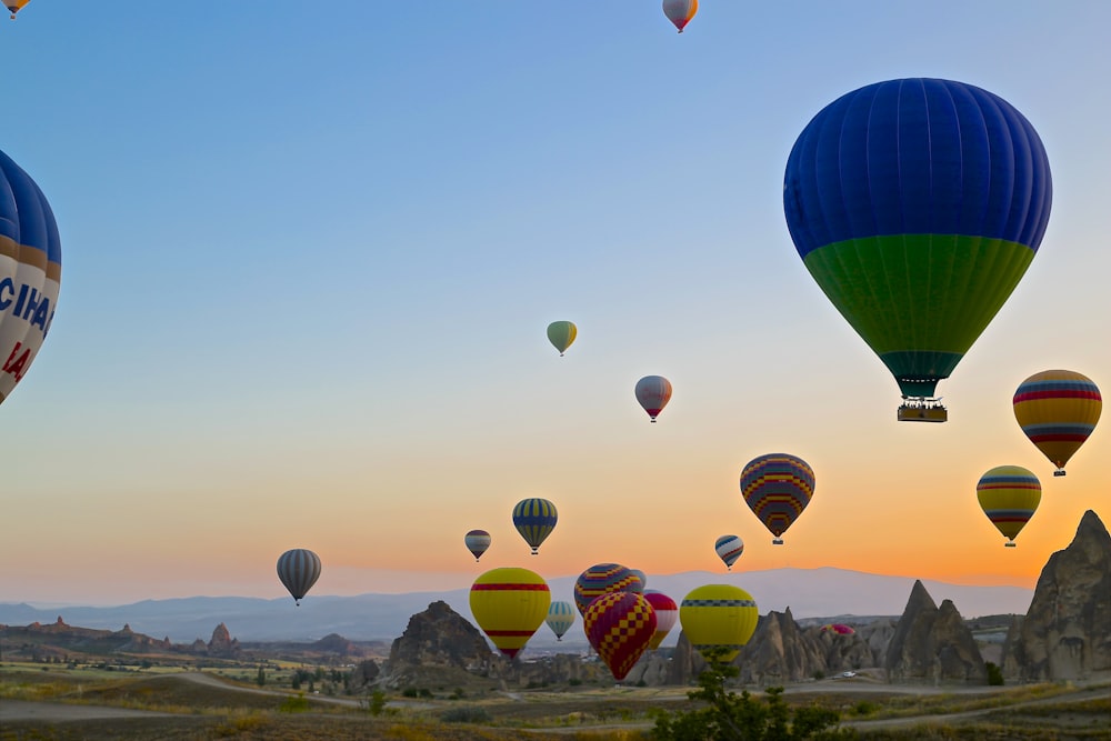 assorted-color hot air balloons in clear blue sky