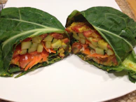 Plates with vibrant veggie wraps filled with tofu, crunchy veggies, and avocado slices