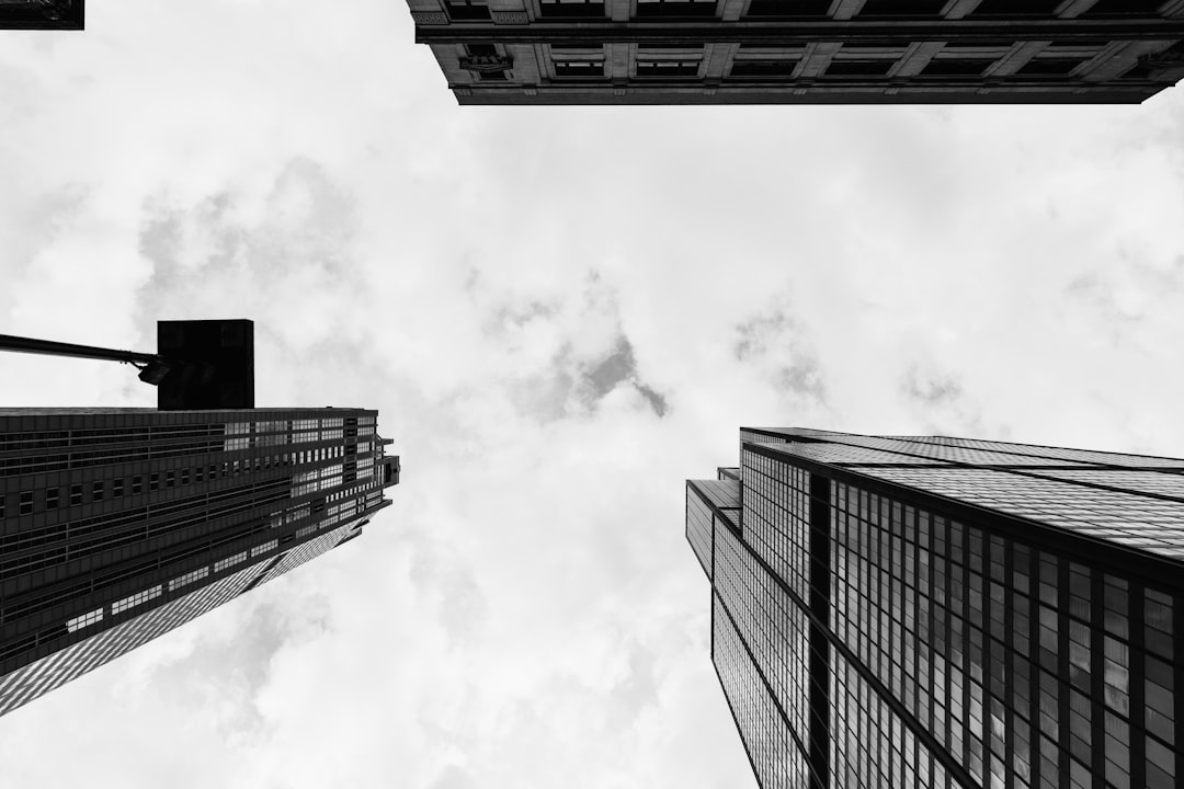 grayscale photo of high rise buildings