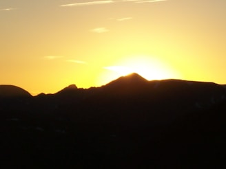 A breathtaking view of a mountain range at sunrise.