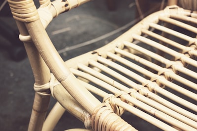 Close-up of handwoven rattan texture on a garden armchair