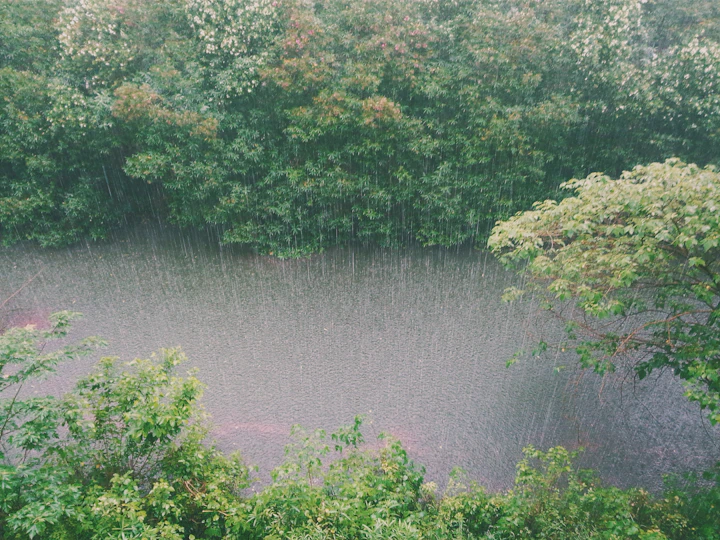 Heavy rain falling on a river