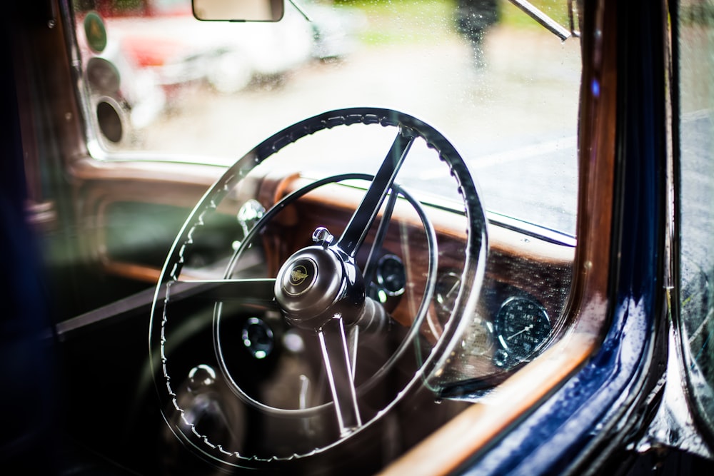 photo of vintage vehicle steering wheel during daytime