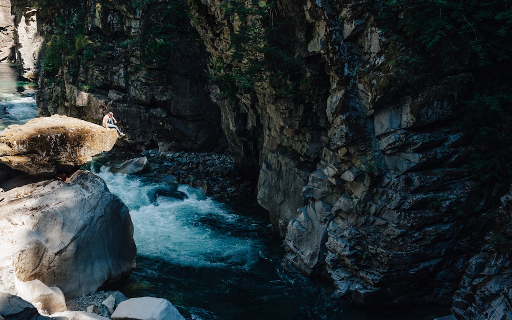 river between rock cliffs