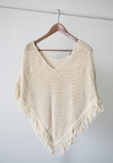 white v neck shirt on brown clothes hanger