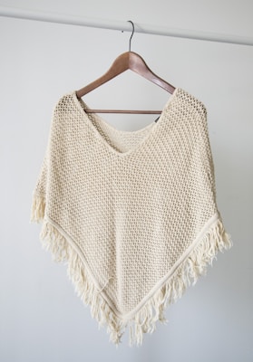 white v neck shirt on brown clothes hanger