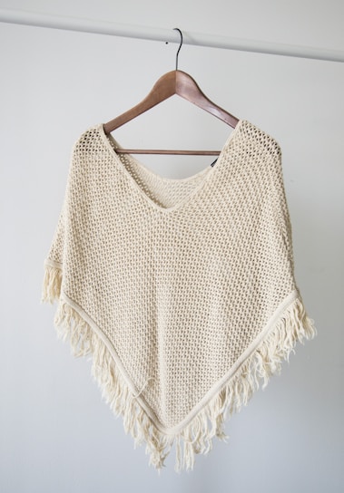 white v neck shirt on brown clothes hanger