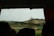 A happy traveler enjoying a scenic view of the English countryside.