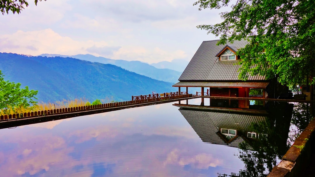 Visiting Taiwan's Wuling Farm offers the iconic Snow Mountain trailhead and serene alpine pond, a scenic and popular destination for nature enthusiasts.