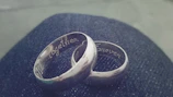 Close-up of a pair of intertwined constellation rings symbolizing connection and care.