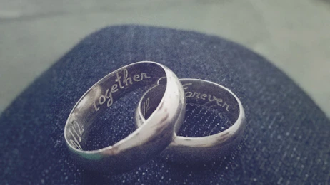 Close-up of intertwined couple bracelets symbolizing connection and lasting bonds.