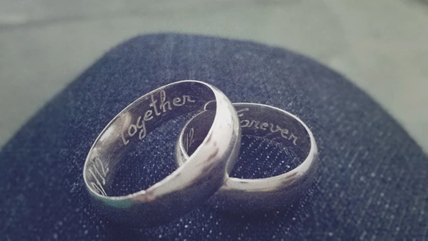 Close-up of intertwined couple bracelets symbolizing connection and lasting bonds.