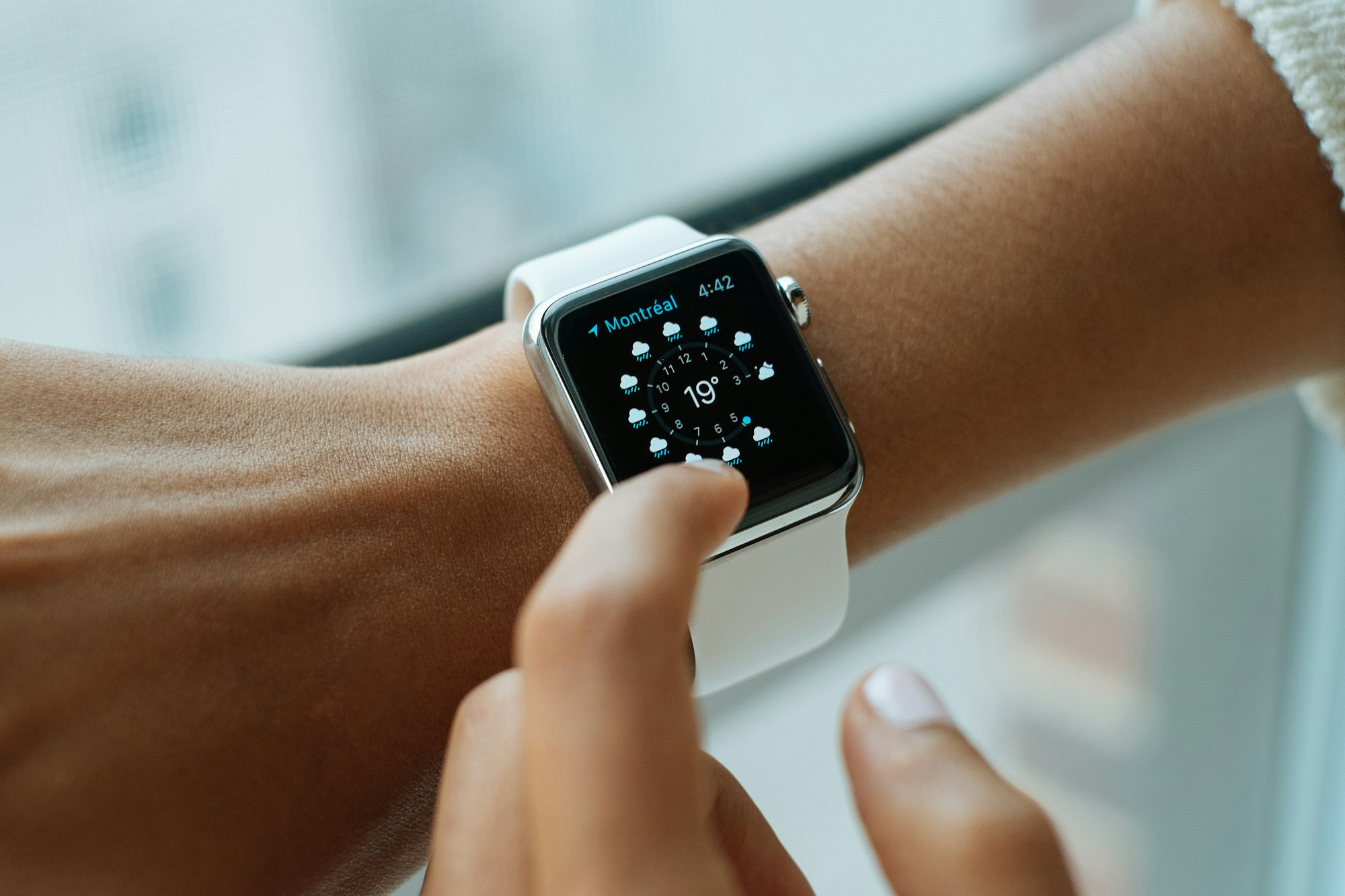 A user Interacting with an Apple Watch