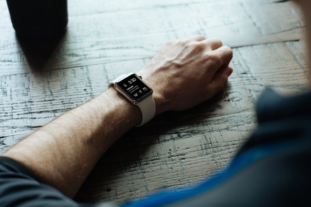 man wearing white smartwatch