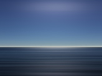 A minimalist blue and sandy landscape evoking calm and infinite possibility.