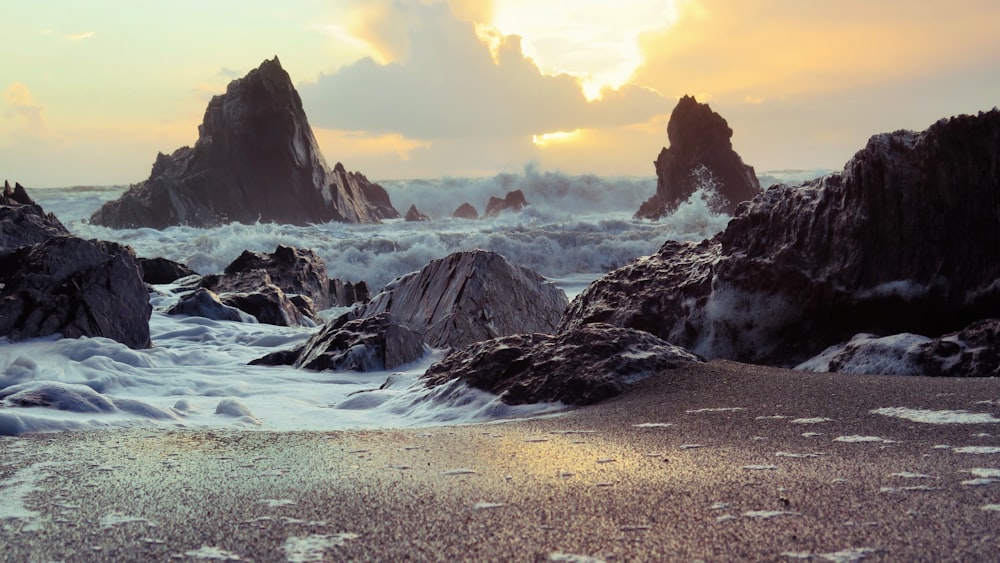 violent waves splashing into rocky coastline during daytime