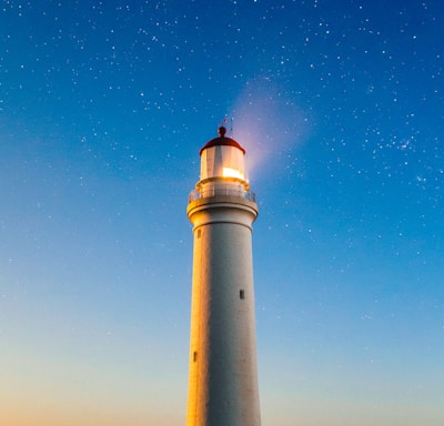 white concrete lighthouse