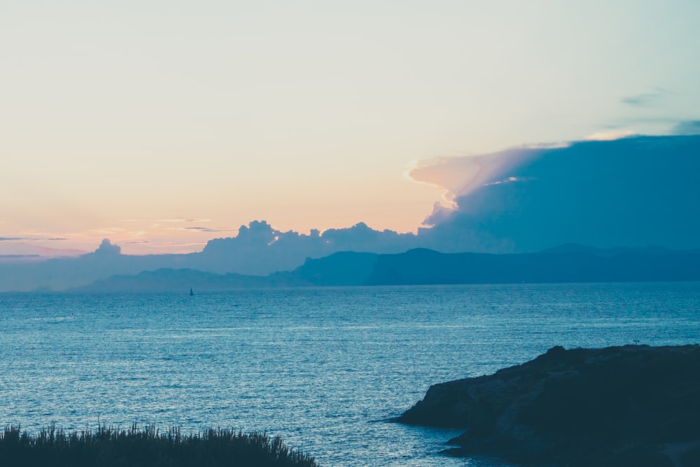 ocean near mountain