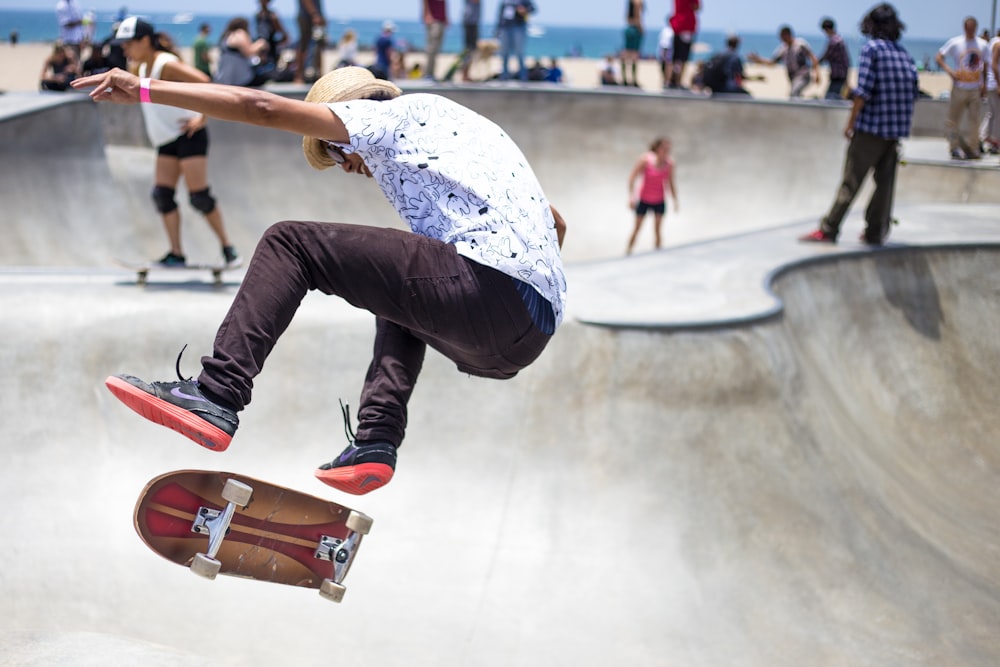 people playing skateboard on skateboard park