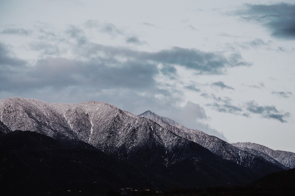 gray mountains under gray clouds