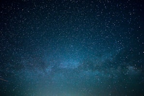 the night sky is filled with stars and bright lights