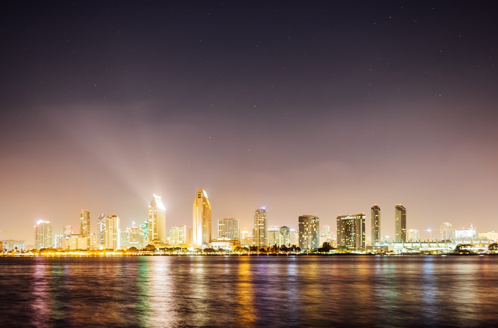 structural photo of high rise buildings near body of water