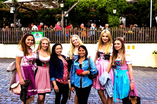A group of women participating in a community cultural event outdoors