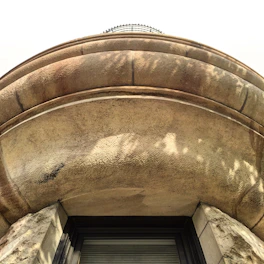Close-up of a finely crafted facade detail showcasing texture and depth.