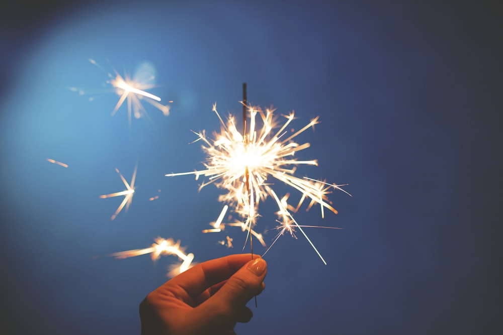 person holding sparkler