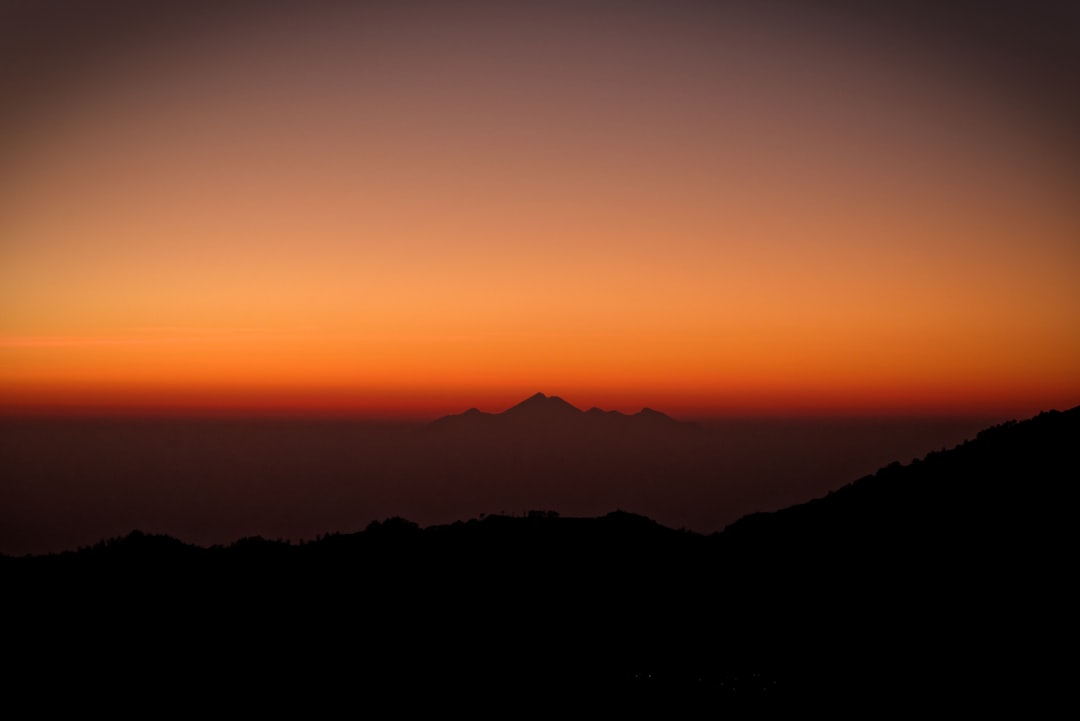 silhouette photography of mountains during sunset