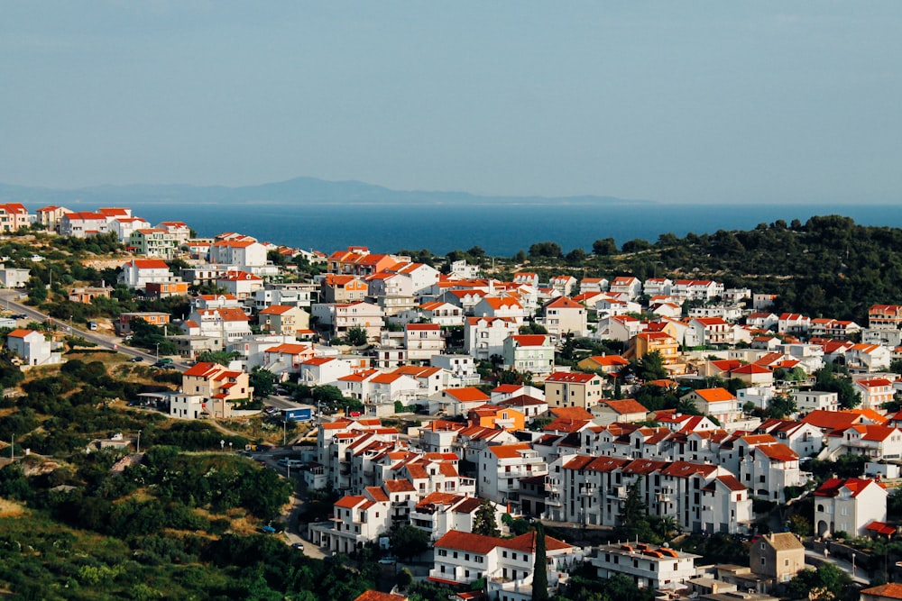 aerial photograph of red-and-white concrete highrise buildings