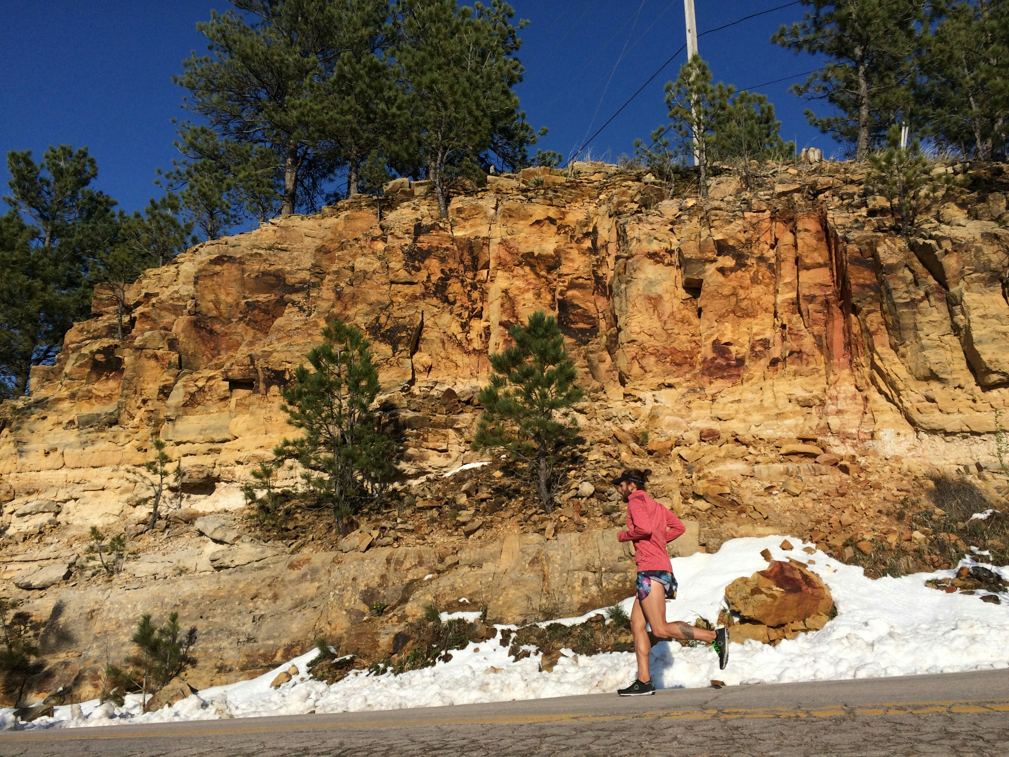 person jogging beside clif