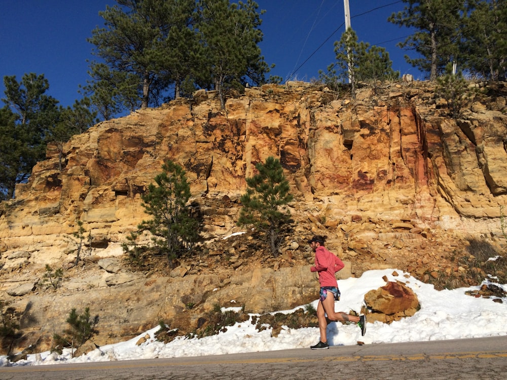 person jogging beside clif