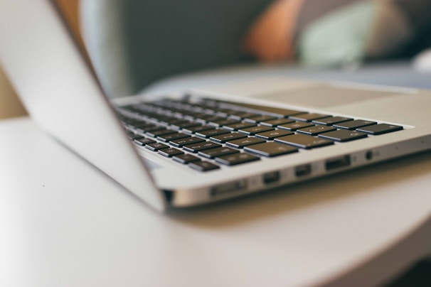 A close-up of a professional laptop on a desk.